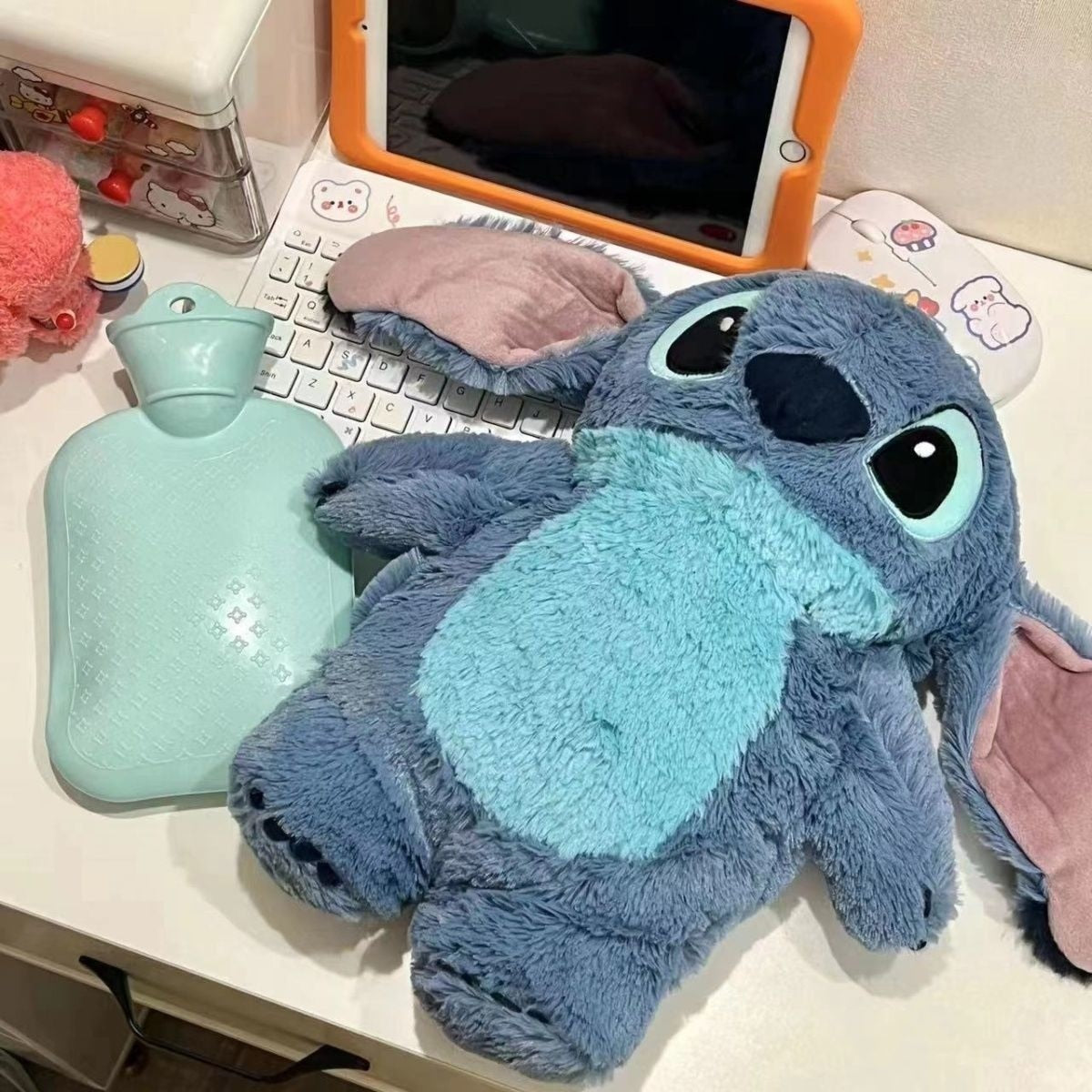 Plush Stitch with hot water bottle