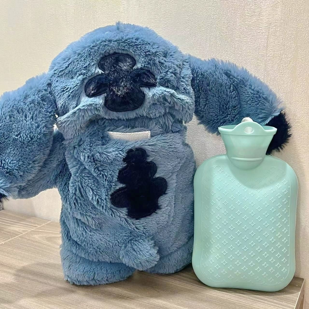 Plush Stitch with hot water bottle