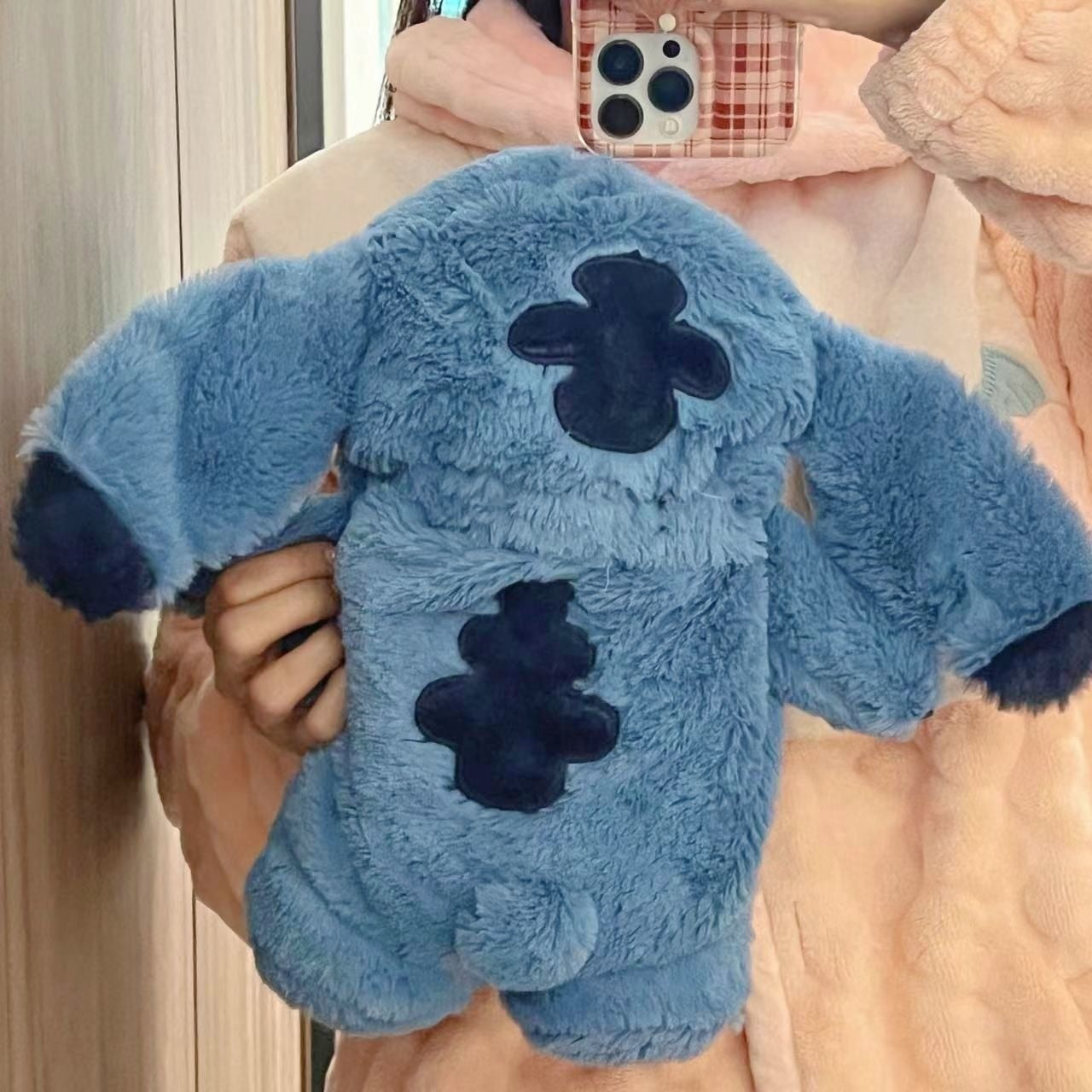 Plush Stitch with hot water bottle